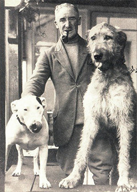 Illustrator Cecil Aldin with Cracker (and wolfhound Micky), 1930